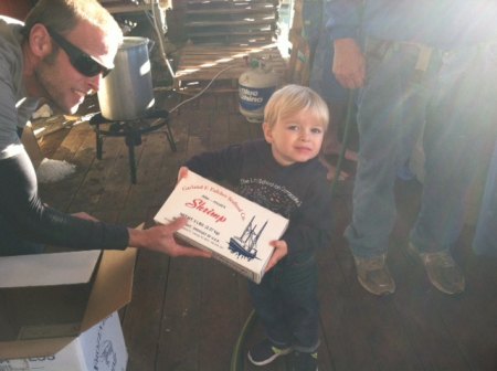 The littlest waterman was Dallas Mason, who was unloading shrimp with his daddy, Shane.